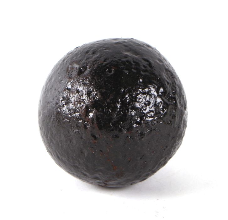 A roundshot iron cannon ball. Approximate diameter of 6.5cms (2.5ins) on a turned oak mount - Image 2 of 2