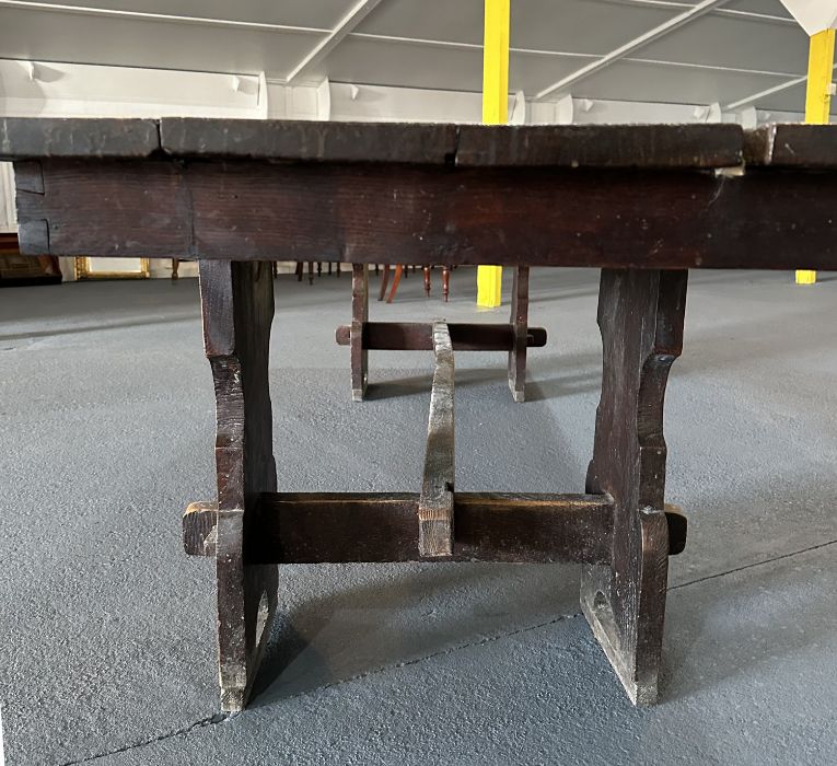 A large 17th century style oak refectory table with four plank top, on trestle supports joined by - Image 5 of 20