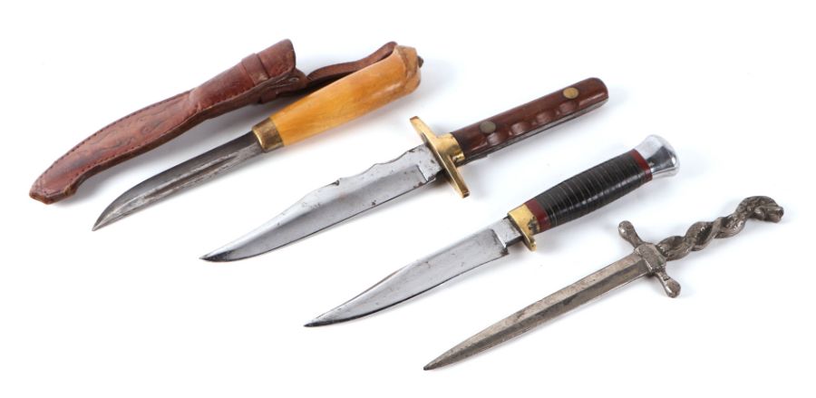 A carved wooden handled sheath knife, 22cms long; together with three similar knives (4).