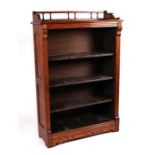 An early 20th century oak open bookcase with three-quarter gallery above three adjustable shelves,