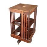 An Edwardian mahogany revolving bookcase, 52cms wide.