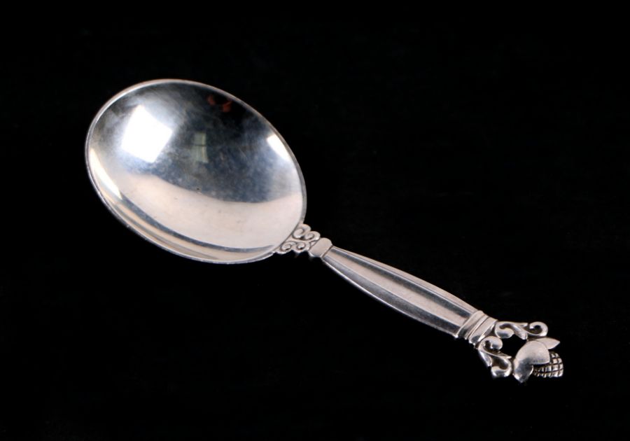 A Georg Jensen silver acorn design caddy spoon, 25g, 10cms long.