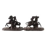 A pair of spelter Animalia groups depicting monkey type figures riding horses, each 20cms wide (2).