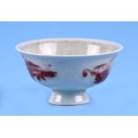 A Chinese footed tea bowl with four character blue mark to the underside, 7.5cms diameter.