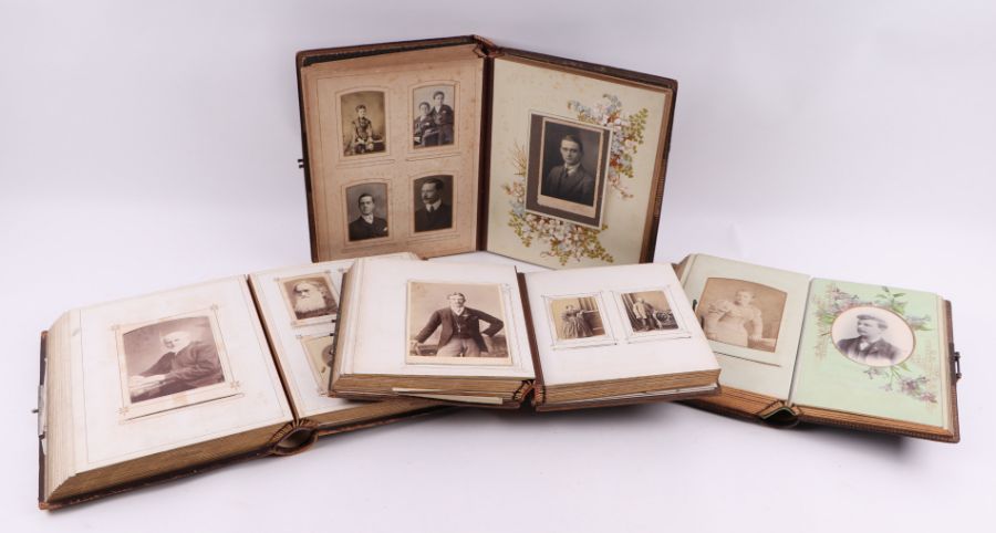 Four leather albums containing carte de visite cabinet cards, various subjects including