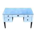 A Julian Chichester modern design mirrored dressing chest with an arrangement of five drawers, on