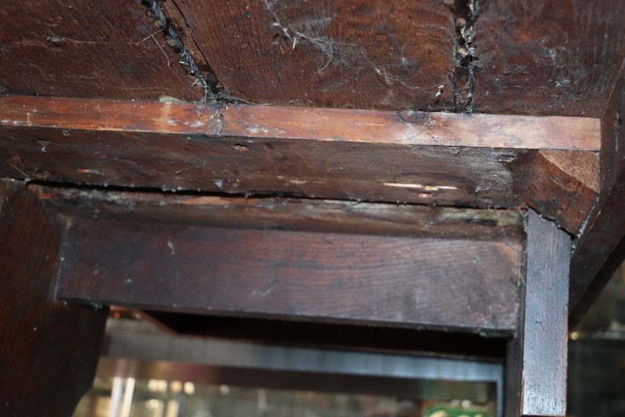 A large 17th century style oak refectory table with four plank top, on trestle supports joined by - Image 6 of 20