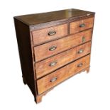 A 19th century oak chest crossbanded in mahogany with an arrangement of two short and three