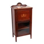 An Edwardian inlaid walnut music cabinet with single panelled door, 52cms wide.