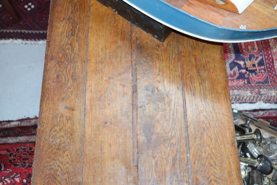 A large 17th century style oak refectory table with four plank top, on trestle supports joined by - Image 13 of 20