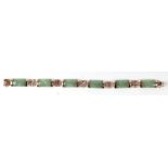 A Chinese 9ct gold and jade panel bracelet, 18cms long.