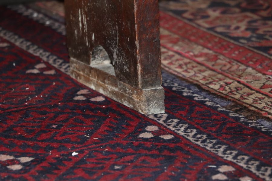 A large 17th century style oak refectory table with four plank top, on trestle supports joined by - Image 8 of 20