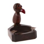 A novelty Henry Howell style ashtray in the form of a bird with what looks to be a cherry amber