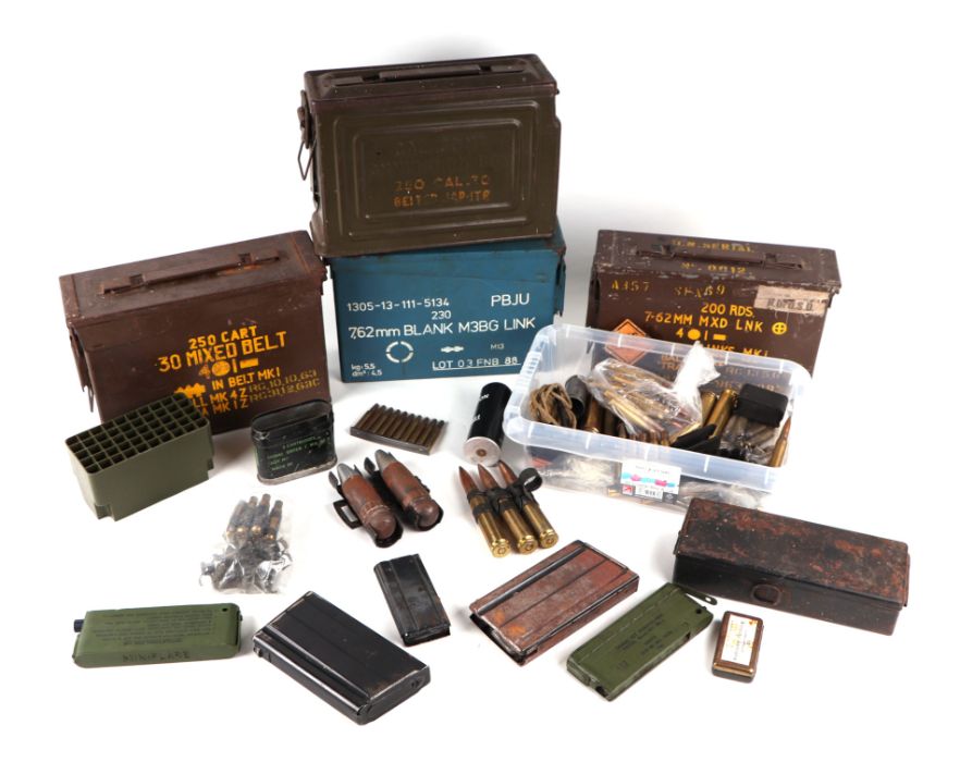 A quantity of assorted military ammunition boxes and inert ammunition.