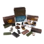 A quantity of assorted military ammunition boxes and inert ammunition.