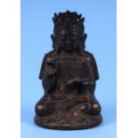 A Chinese bronzed metal seated figure depicting a Buddha, 14cms high.Condition ReportThe figure is