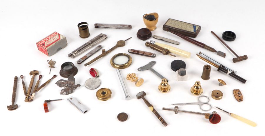 A quantity of collectable items to include penknives; brass telescope lenses; and other similar