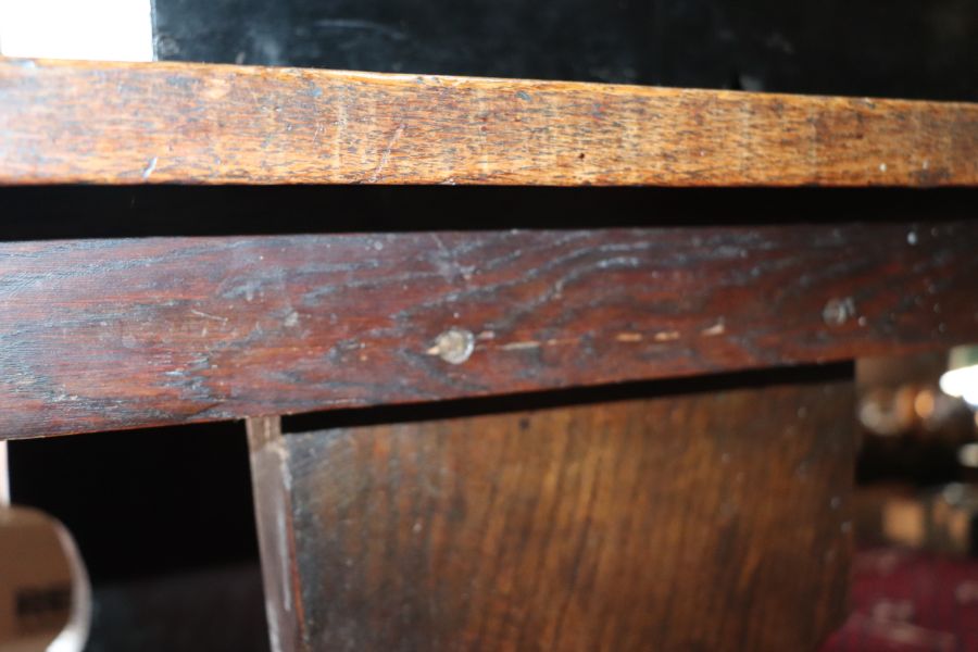 A large 17th century style oak refectory table with four plank top, on trestle supports joined by - Image 11 of 20