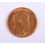 An Edward VII 1910 gold sovereign.