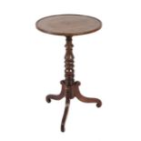 A 19th century mahogany tripod table with dished circular top, on a turned column, 46cms diameter.