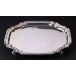 A George III style silver salver of shaped rectangular form, on scroll feet, London 1973, 587g, 26.