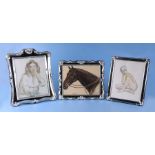 Three large silver plated photograph frames, the largest overall 29 by 34cms (3).