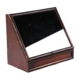A tabletop display cabinet with sloping front, 34cms wide.