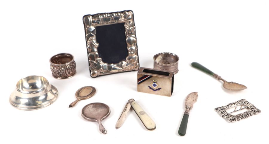 A small quantity of silver items to include a Victorian nurses buckle, London 1894; together with