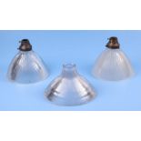 Two Holophane moulded glass ceiling lights with brass fittings, 21cms diameter; together with a