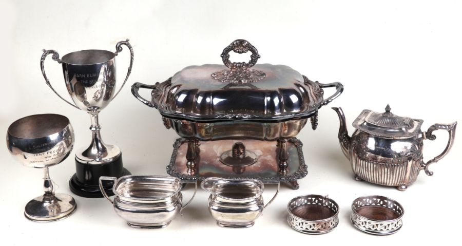 A quantity of assorted silver plated items to include coasters, trophy cups, entree dish and cover