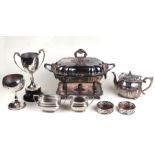 A quantity of assorted silver plated items to include coasters, trophy cups, entree dish and cover