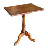 A 19th century mahogany tripod table with rectangular top, on a tapering turned column, 59cms wide.