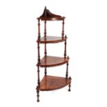 A Victorian walnut graduated four-tier corner whatnot with inlaid decoration, the largest tier 62cms