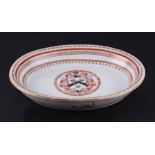 A Chinese armorial oval dish with the arms for William Walker of Hertfordshire, 23cms wide.