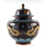 A large Chinese cloisonné vase and cover decorated with yellow dragons chasing a flaming pearl, on a