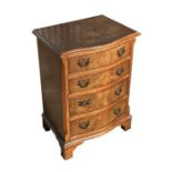 A Shaw of London George III style serpentine walnut chest of drawers of small proportions with