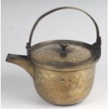 A late 18th / early 19th century Japanese bronze kettle with engraved chrysanthemum decoration, with