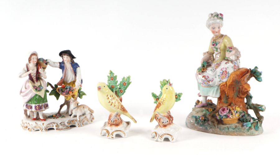 A group of continental porcelain figures, the largest 22cms (4).