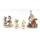 A group of continental porcelain figures, the largest 22cms (4).