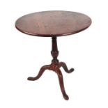 A 19th century oak tripod table with birdcage movement, the turned column on a tripod base with