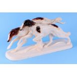 A Katzhutte Art Deco group of two running Borzoi, 34cms wide.