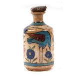 A Palestine / Iznik bottle decorated with birds and flowers, 15cms high.Condition ReportNibbling