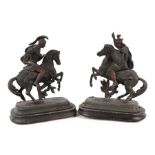 A pair of bronzed spelter groups depicting warriors on horseback, 31cms high (2).