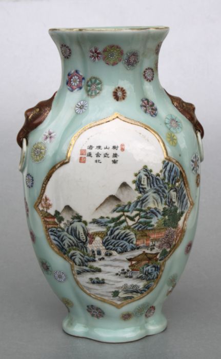 A Chinese Republic style vase decorated with landscapes and calligraphy within panels, on a