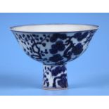 A Chinese blue & white stem cup decorated with flowers, six character mark to the inside of the