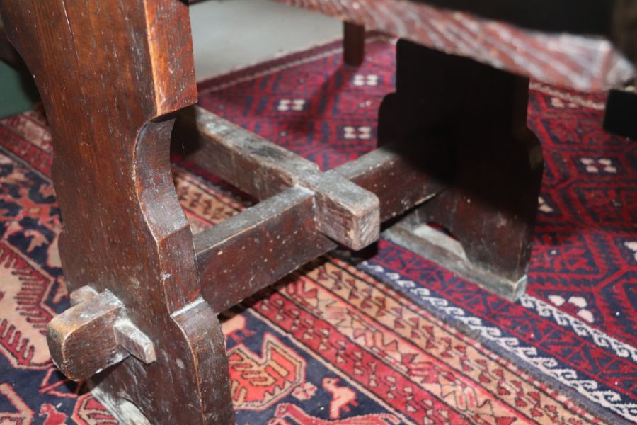 A large 17th century style oak refectory table with four plank top, on trestle supports joined by - Image 17 of 20