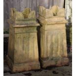 A pair of pottery chimneypot planters, 72cms high (2).