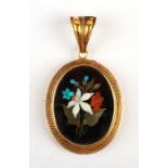 A Victorian gold (unmarked) pendant with pietra dura floral panel and vacant glass window panel