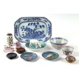 A late 18th century Chinese underglazed blue porcelain platter decorated with a landscape scene,