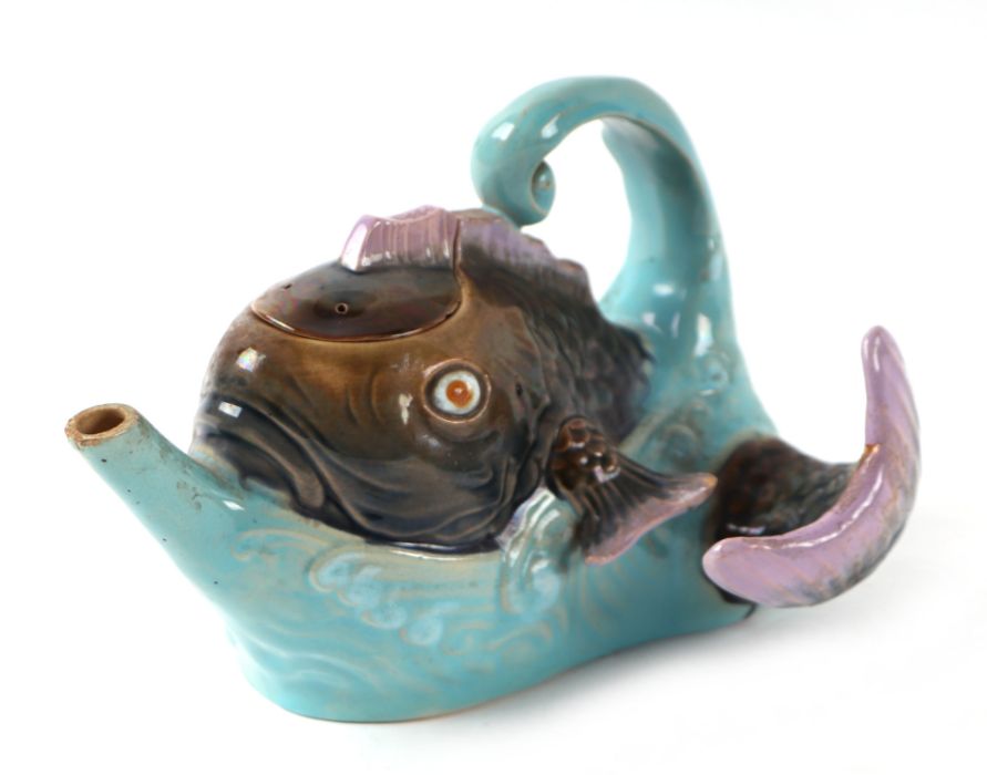 A late Victorian Brownfield majolica teapot and cover in the form of a fish jumping out of the